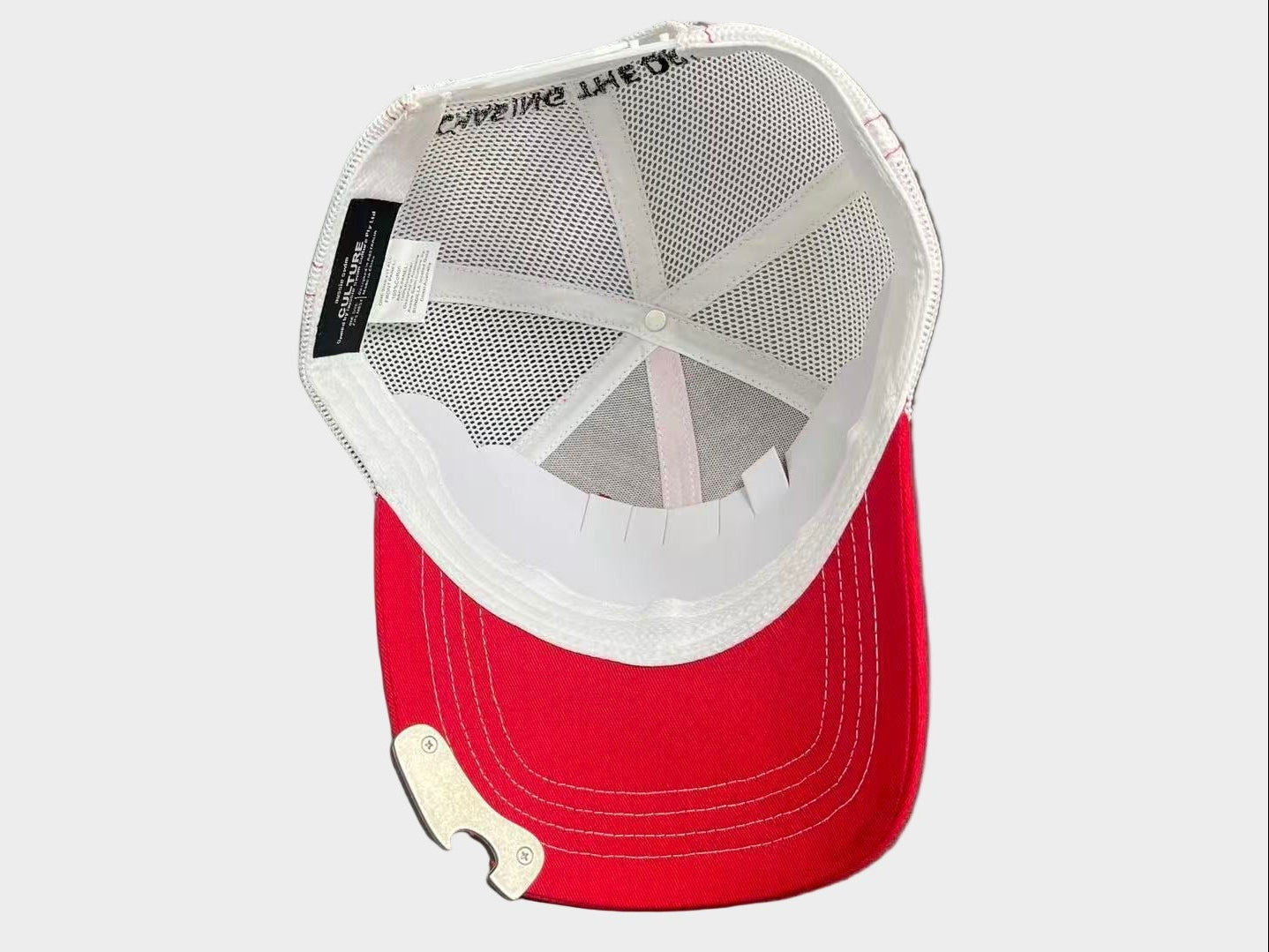 Red cap with white mesh back and black logo on a white background