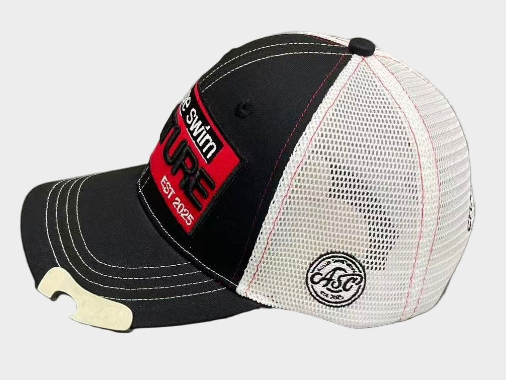 Black and white cap with a red label on a gray surface