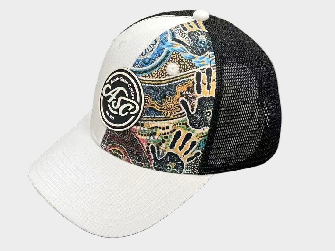 Colorful trucker hat with a pattern on a gray surface